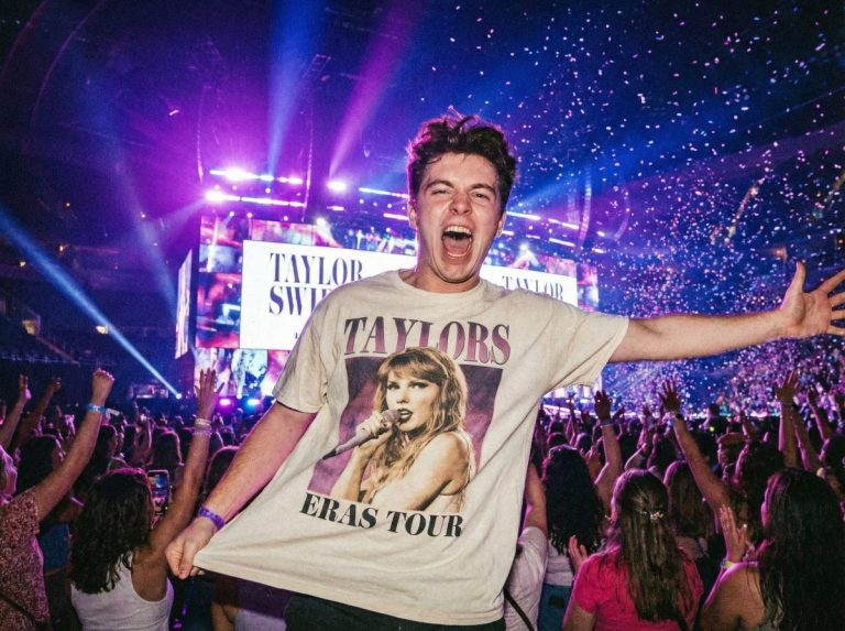 Man wearing concert graphic tee with jeans